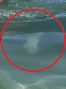 ghostly hand at beach.